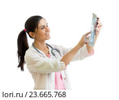 doctor reviewing x-ray photo isolated. Стоковое фото, фотограф Оксана Кузьмина / Фотобанк Лори