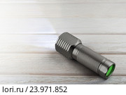 Bright LED flashlight shines. Стоковое фото, фотограф Alexander / Фотобанк Лори