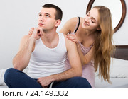 wife warmly comforting upset husband in bedroom. Стоковое фото, фотограф Яков Филимонов / Фотобанк Лори