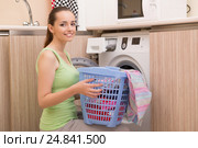 Woman doing laundry at home. Стоковое фото, фотограф Elnur / Фотобанк Лори