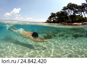 Split level, the man diving, Cleopatra island (Sedir Island), Aegean Sea, Turkey (2012 год). Редакционное фото, фотограф Некрасов Андрей / Фотобанк Лори