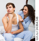 Wife wheedling forgiveness from husband after argue. Стоковое фото, фотограф Яков Филимонов / Фотобанк Лори