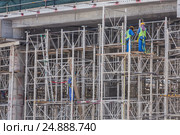 Team of construction worker on construction site. Стоковое фото, фотограф Matej Kastelic / Фотобанк Лори