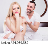 Husband comforting wife in bedroom. Стоковое фото, фотограф Яков Филимонов / Фотобанк Лори