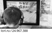 Black and white footage caucasian boy in headphones playing the computer game. the concept of gambling addiction, computer addiction. selective focus. Стоковое видео, видеограф Андрей С / Фотобанк Лори
