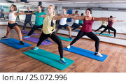 Happy adults having group fitness class. Стоковое фото, фотограф Яков Филимонов / Фотобанк Лори