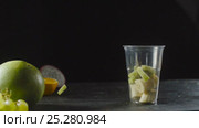 Chef Add Kiwi in Fruit Cocktail Cup with Banana. Стоковое видео, видеограф Станислав Панкратов / Фотобанк Лори