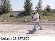 Nordic Walking - elderly woman is hiking in the summer. Стоковое фото, фотограф Наталия Макарова / Фотобанк Лори