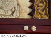 Playing dice on a game board. Стоковое фото, фотограф Timofey Rybkin / Фотобанк Лори