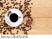 Cup of black coffee, chocolate and coffee beans on a wooden background. Стоковое фото, фотограф Феликс Хромых / Фотобанк Лори
