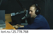 Handsome happy radio host moderating in studio. Стоковое видео, видеограф Виктор Аллин / Фотобанк Лори