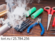 Check RDA. Set to vape. Tools, cotton, liquid, RDA, RTA. Стоковое фото, фотограф Сергей Лабутин / Фотобанк Лори