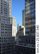 NEW YORK, USA - SEP 08, 2014: Tower Woolworth Building between skyscrapers. Редакционное фото, фотограф Losevsky Pavel / Фотобанк Лори