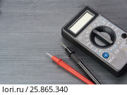 Multimeter on a dark wooden background. Стоковое фото, фотограф Alexander / Фотобанк Лори