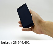 Black smartphone in hand. Стоковое фото, фотограф Дмитрий Родин / Фотобанк Лори