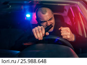 Angry drunk man sitting in car with beer bottle. Стоковое фото, фотограф Pavel Biryukov / Фотобанк Лори