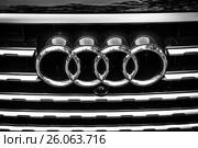 BERLIN - JUNE 14, 2015: The emblem on the front grille of a full-size luxury crossover SUV Audi Q7 3.0 TDI quattro. Black and white. The Classic Days on Kurfuerstendamm. Редакционное фото, фотограф Sergey Kohl / Фотобанк Лори