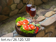 Bruschetta appetizer with red wine on wooden table. Стоковое фото, фотограф Марина Володько / Фотобанк Лори