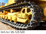 Heavy yellow construction bulldozer. Closeup view of old caterpillar tractor. Стоковое фото, фотограф FotograFF / Фотобанк Лори
