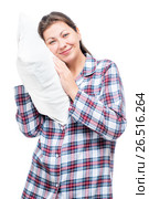 Vertical portrait of a woman in pajamas with a soft pillow isolated. Стоковое фото, фотограф Константин Лабунский / Фотобанк Лори