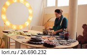 Woman in workshop creating at desktop. Стоковое видео, видеограф Алексндр Сидоренко / Фотобанк Лори