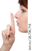 a girl holds a finger to lips gesture silently. Стоковое фото, фотограф Tatjana Romanova / Фотобанк Лори
