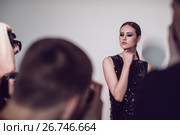 Photographers paparazzi take photos of woman in cocktail dresses. Стоковое фото, фотограф Женя Канашкин / Фотобанк Лори