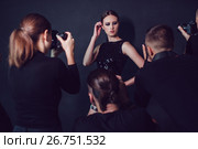 Photographers paparazzi take photos of beautiful woman in cocktail dresses. Стоковое фото, фотограф Женя Канашкин / Фотобанк Лори
