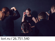Photographers paparazzi take photos of beautiful woman in cocktail dresses. Стоковое фото, фотограф Женя Канашкин / Фотобанк Лори