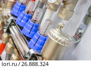 Water flowmeters, several pieces in a row. Стоковое фото, фотограф Андрей Радченко / Фотобанк Лори
