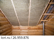 Wall heat isolation with mineral wool in wooden house, building under construction. Стоковое фото, фотограф Сергей Дорошенко / Фотобанк Лори