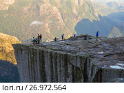 Preikestolen or Prekestolen or Preacher's Pulpit or Pulpit Rock, is a famous tourist attraction in Forsand, Ryfylke, Norway (2017 год). Редакционное фото, фотограф Алексей Ширманов / Фотобанк Лори