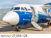 Самолет Ан-148-100Е (бортовой номер RA-61709) авиакомпании «Полет» на обслуживании в московском международном аэропорту Домодедово. Май 2012 года. Редакционное фото, фотограф Владимир Сергеев / Фотобанк Лори