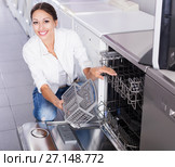 Woman choosing dish washing machine. Стоковое фото, фотограф Яков Филимонов / Фотобанк Лори