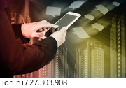 Male hands with smartphone on icons flying and skyscrapers background. Стоковое фото, фотограф Яков Филимонов / Фотобанк Лори