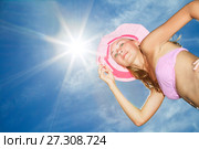 Beautiful young Woman posing in pink bikini again blue sky with sun. Стоковое фото, фотограф Курганов Александр / Фотобанк Лори