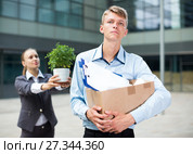 Serious man is standing upset near office. Стоковое фото, фотограф Яков Филимонов / Фотобанк Лори