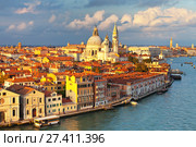 Italy. Venice. Top view of the Dorsoduro district, Cathedral of Santa Maria della Salute, embankment Zattere and Church of Spirito Santo in the rays of the setting sun (2016 год). Стоковое фото, фотограф Виктория Катьянова / Фотобанк Лори