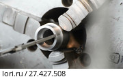 The turner measures the part by means of a caliper, then makes a test installation of the bearing in the hole. Стоковое видео, видеограф Андрей Радченко / Фотобанк Лори