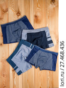 set of cotton panties for boy clothes on wooden boards top view. Стоковое фото, фотограф Константин Лабунский / Фотобанк Лори