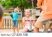 Children are teetering on the swing. Стоковое фото, фотограф Яков Филимонов / Фотобанк Лори