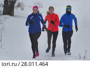 Group of young athletes running technically in winter forest. Стоковое фото, фотограф Константин Шишкин / Фотобанк Лори