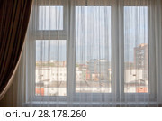 Beautiful view on roofs of houses on sunny summer day from home window. Стоковое фото, фотограф Наталья Николаева / Фотобанк Лори