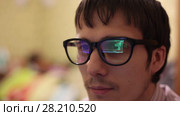 Programmer behind the monitor. Internet Addiction Reflection Hacker Crime Glasses Browsing Late Night Code Cyber Terrorism Password Hacking. Стоковое видео, видеограф Артем Тюгашов / Фотобанк Лори