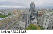 MOSCOW - MAY 20, 2015: Cityscape with traffic near business complex Orugheiny at spring cloudy day. Aerial view. Редакционное фото, фотограф Losevsky Pavel / Фотобанк Лори