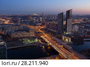 Residential building under construction, Third Transport Ring, river at night in Moscow, Russia (2016 год). Стоковое фото, фотограф Losevsky Pavel / Фотобанк Лори
