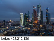 MOSCOW - APR 23, 2016: Moscow International Business Center at night. Investments in Moscow International Business Center was approximately 12 billion dollars. Редакционное фото, фотограф Losevsky Pavel / Фотобанк Лори