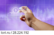 A man holds a glass screen with a bitcoin symbol and a crypto currency graph. Стоковое фото, фотограф Ярослав Данильченко / Фотобанк Лори