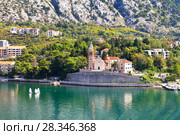 Montenegro. Kotor Bay. Scenic view from the water to the Church of St. Matthew (Crkva Sv. Matije, 1670) with the bell tower in the Dobrota town (2016 год). Стоковое фото, фотограф Виктория Катьянова / Фотобанк Лори