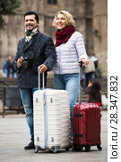 Mature couple walking with luggage. Стоковое фото, фотограф Яков Филимонов / Фотобанк Лори